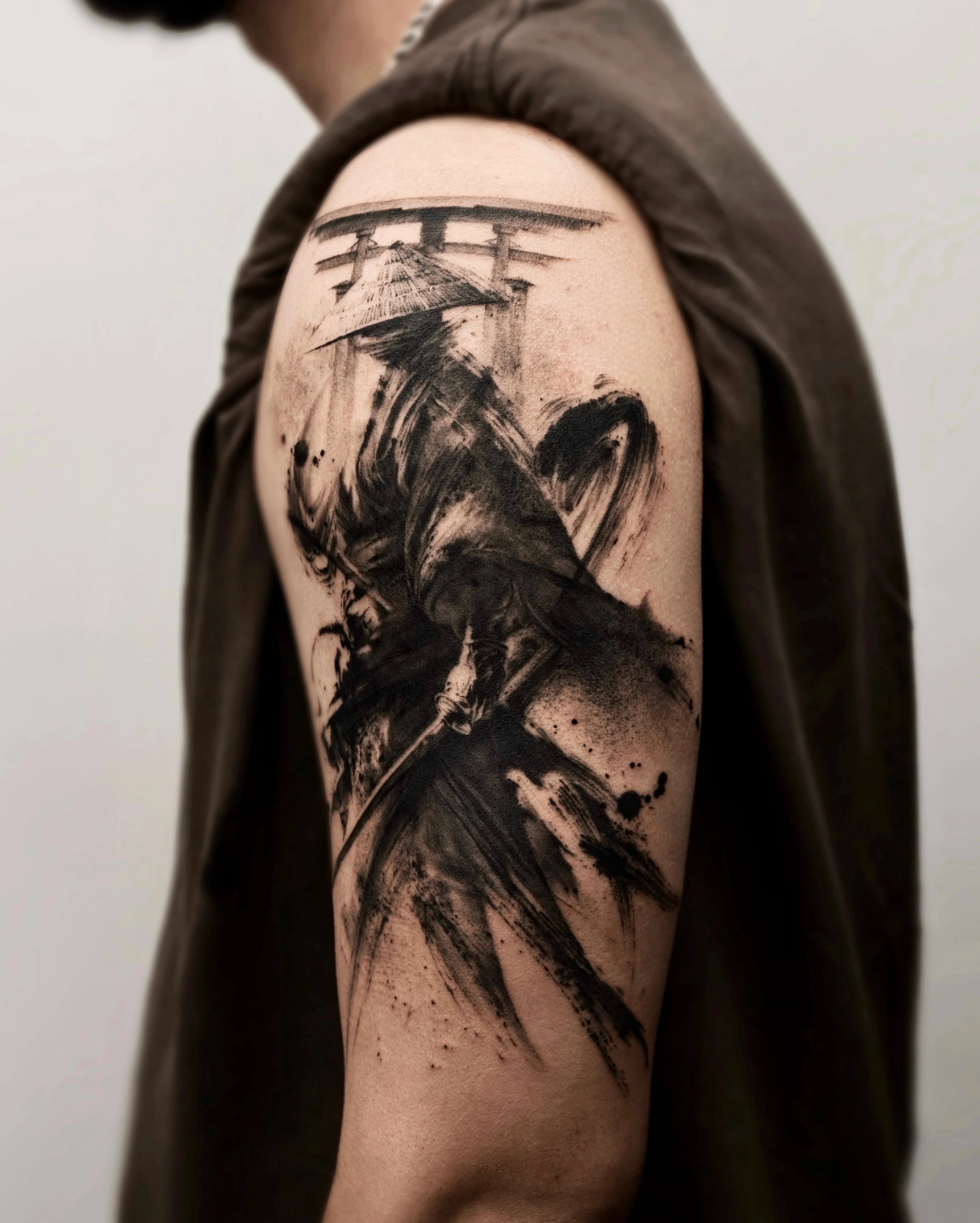 Side angle of the samurai tattoo showing the cloth movement and brush texture